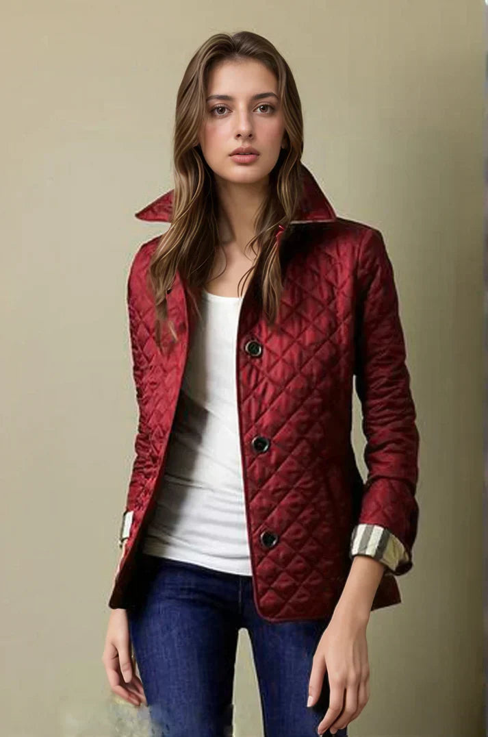 Fashionable women's quilted jacket with front buttons, offering lightweight warmth for crisp fall days or cool spring evenings.