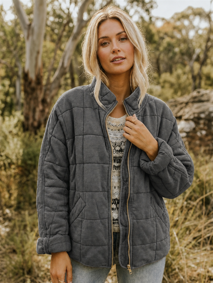 Women's quilted jacket with zip front & stand collar. Ideal for fall layering & everyday warmth.
