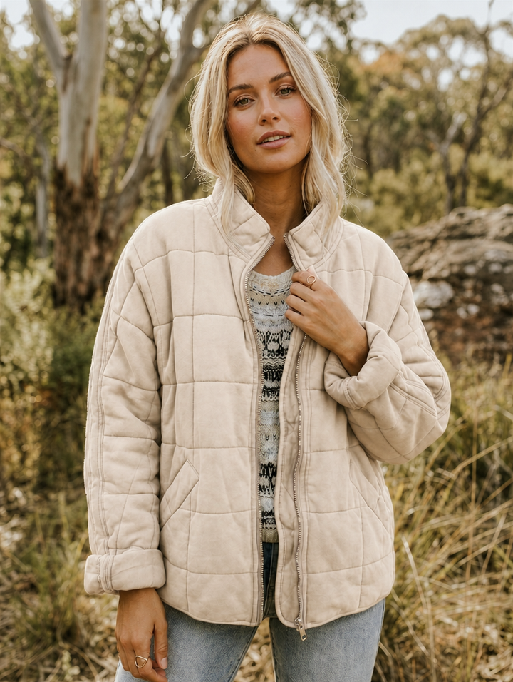 Cozy women's quilted jacket, offering essential warmth & effortless style for winter & fall outfits.