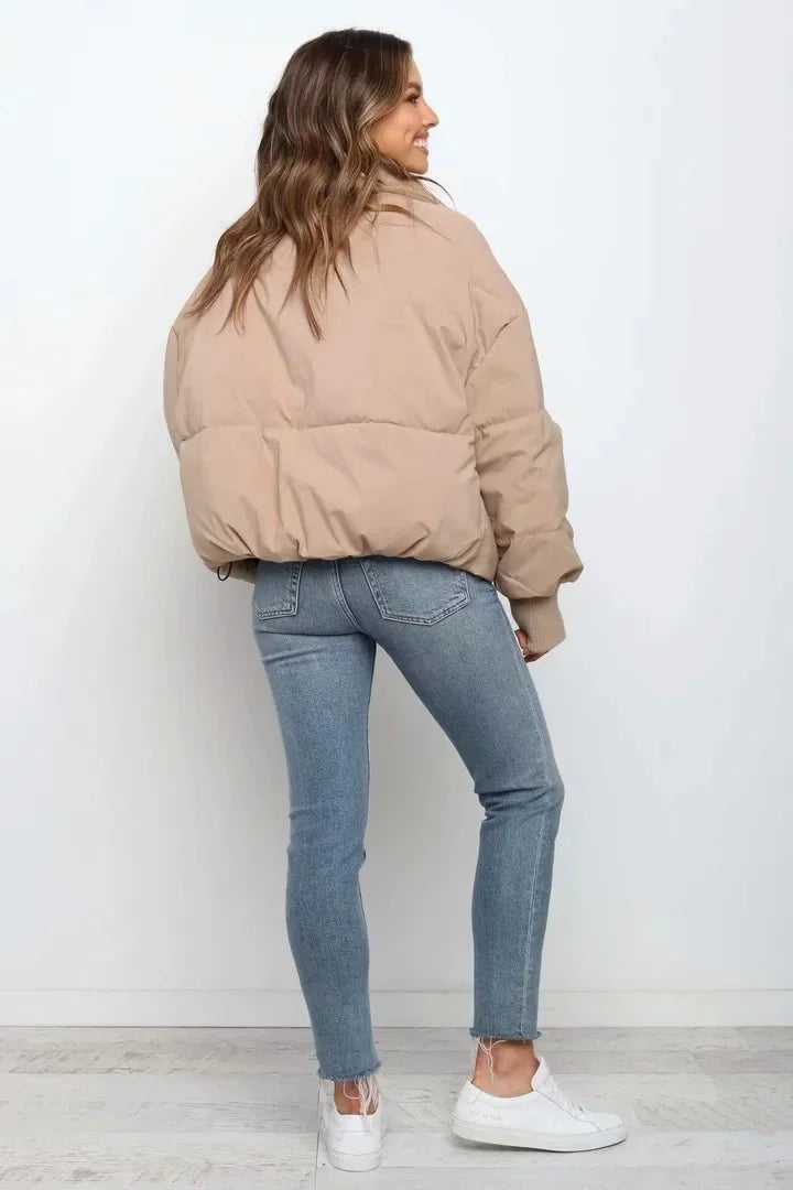 Warm women's quilted puffer jacket for cold weather. Cozy and stylish outerwear for casual, everyday fashion.