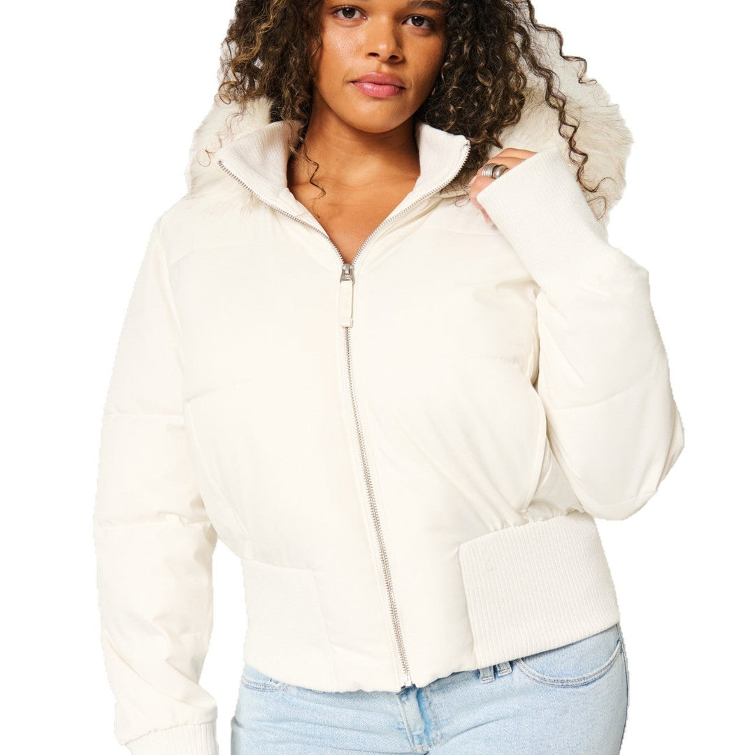 Cozy women's quilted winter outerwear, featuring a chic design and a practical detachable hood for warmth.
