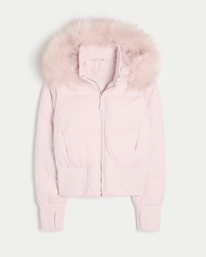 Modern women's quilted winter jacket, designed for warmth with a sleek finish and a functional removable hood.