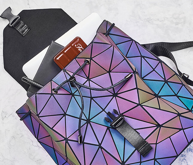 Fashionable geometric backpack for women, reflective & color-changing, secure zipper, versatile daily carry.