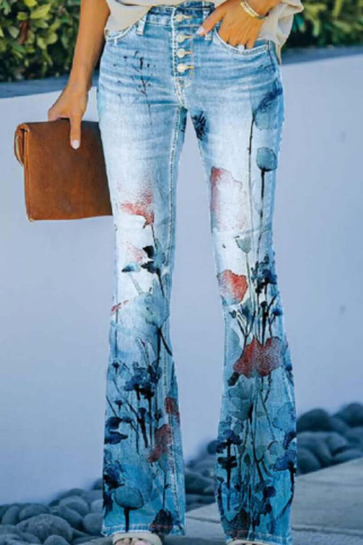 Back view of women's embroidered jeans, highlighting stylish pockets & comfortable regular fit.