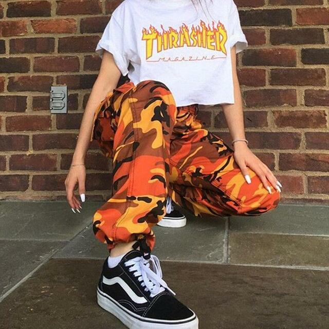 Women's relaxed fit baggy camo cargo pants with elastic ankle cuffs, ideal for trendy streetwear look.