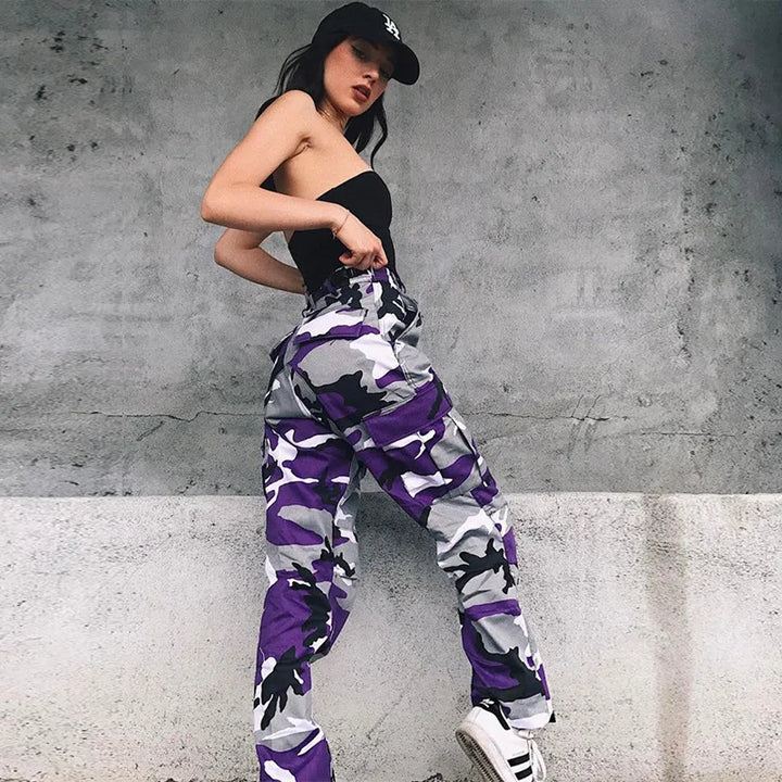 Detailed view of women's camo print baggy cargo pants, highlighting multiple cargo pockets & elastic ankle cuffs.