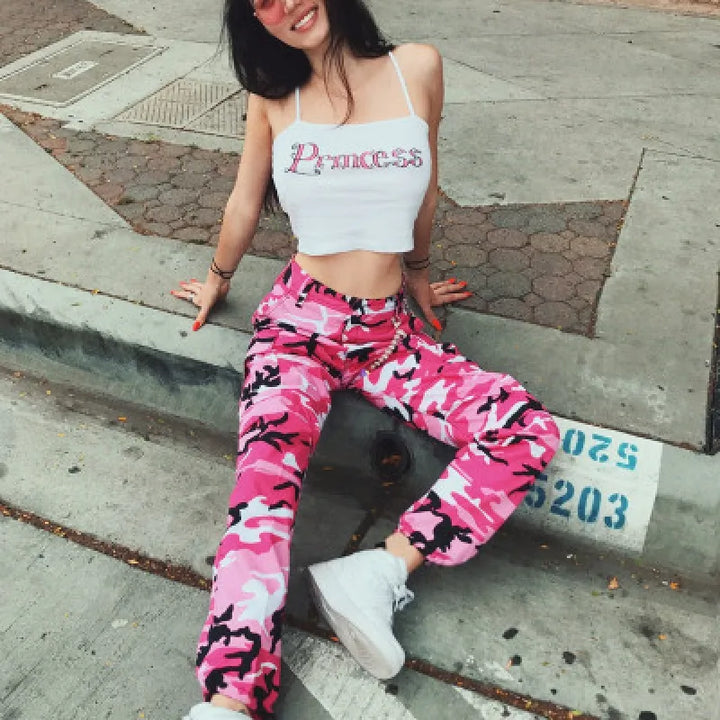 Stylish women's baggy camo cargo pants showcasing a relaxed fit, trendy ankle cuffs, and statement camo print.
