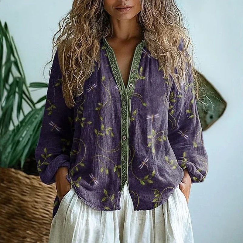 Women's relaxed fit blouse with a vibrant nature print, perfect for casual chic everyday wear.