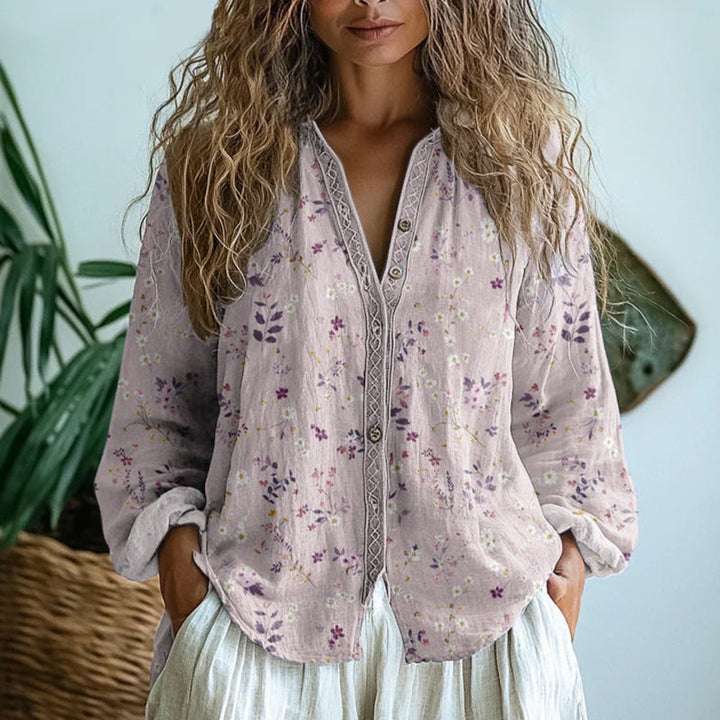 Elegant long-sleeve women's blouse featuring a beautiful floral nature print, comfortable and versatile.