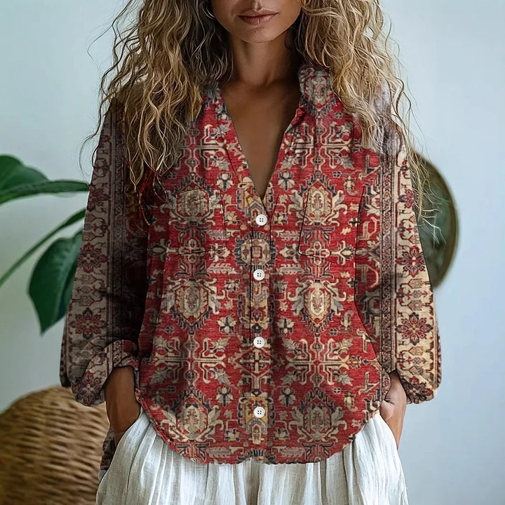 Women's relaxed fit blouse in soft fabric, adorned with a delicate nature print, offering casual elegance.