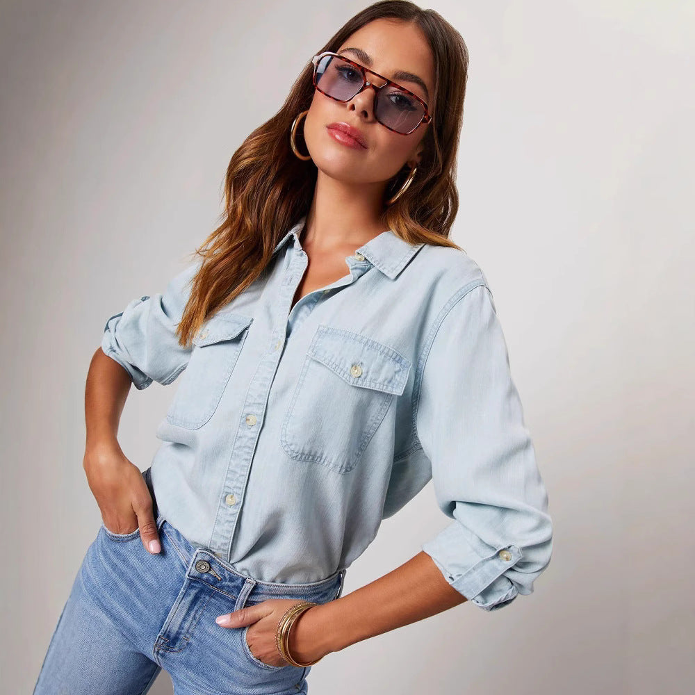 Stylish women's relaxed denim shirt with chest pockets, long sleeves, and a comfortable button-down design.