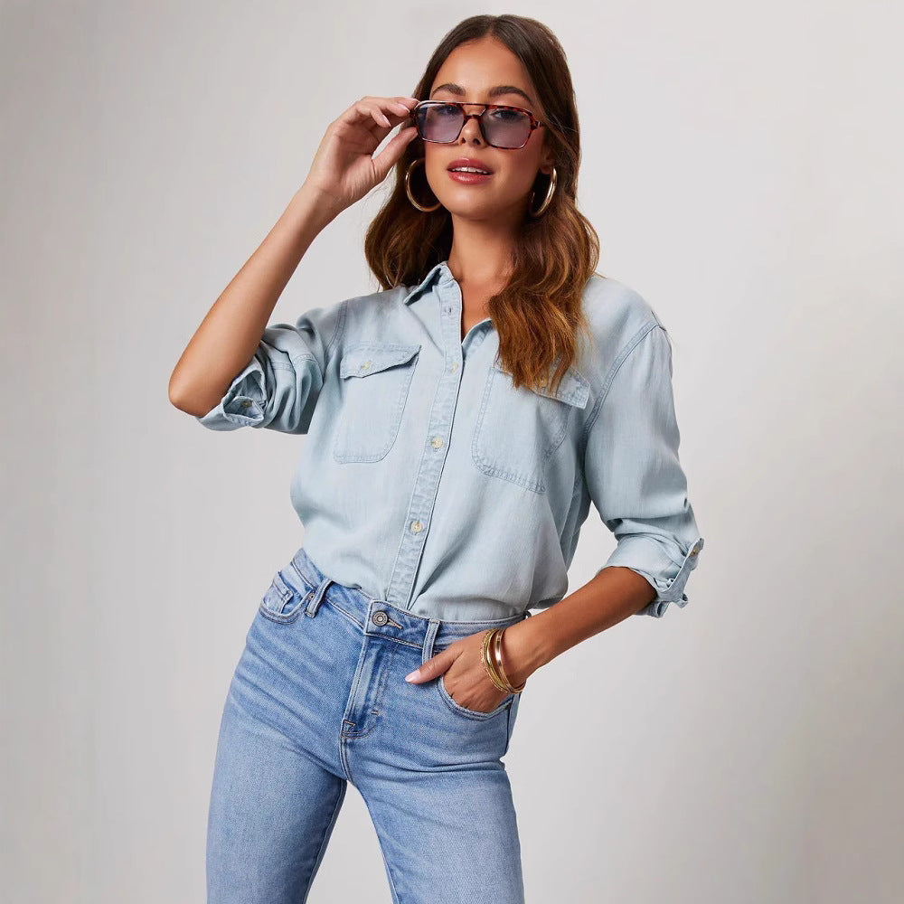 Blue denim women's shirt, relaxed fit, long sleeve, button-down with chest pockets. Perfect casual fashion top.
