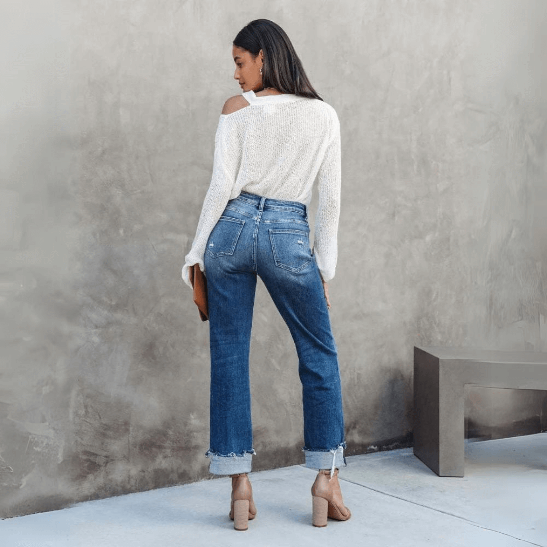 Comfortable women's relaxed fit denim jeans featuring a unique irregular waist design for a trendy look.