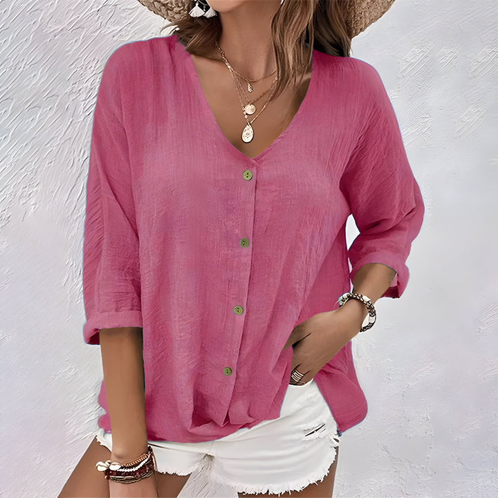 Chic women's button-up blouse with a relaxed fit. Elegant long sleeve top, suitable for both casual and work settings.