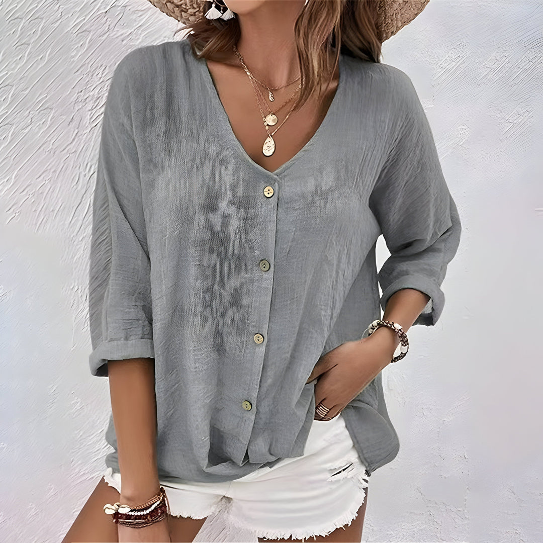 Effortlessly chic women's relaxed button-up blouse. Long sleeve top combines comfort, elegance, and workwear style.