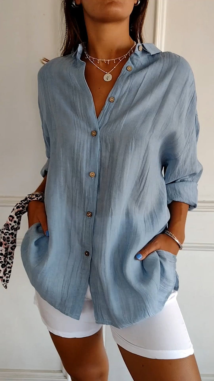 Women's relaxed fit button-up long sleeve shirt, a versatile casual top for everyday fashion.