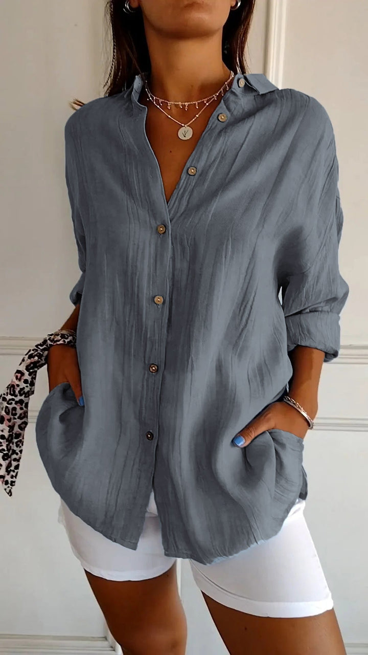 Elegant women's relaxed fit long sleeve button-up shirt, a comfortable and stylish option for work or leisure.