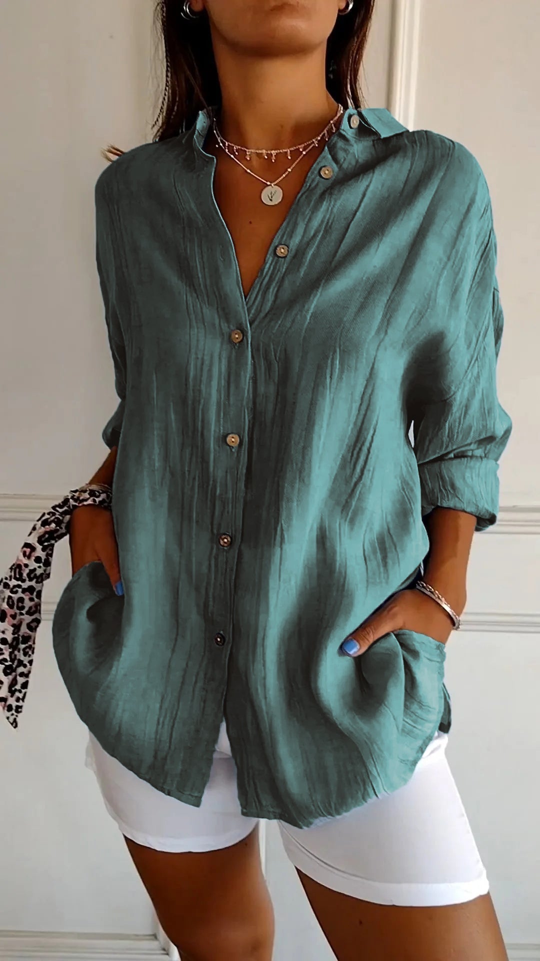 Stylish women's relaxed fit button-up long sleeve shirt, an everyday fashion staple for comfort.