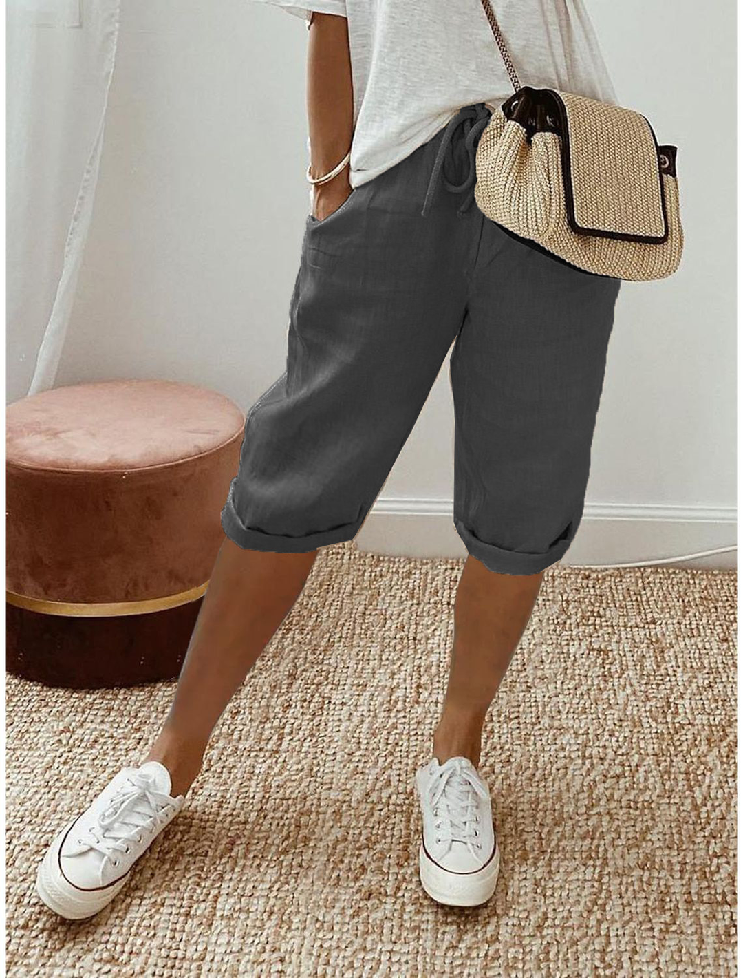 Mid-calf hem detail of women's relaxed fit capri pants, comfortable for summer fashion.