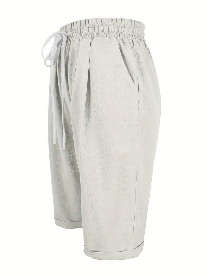 Women's relaxed fit capri pants styled casually for summer, a comfortable and fashionable everyday look.