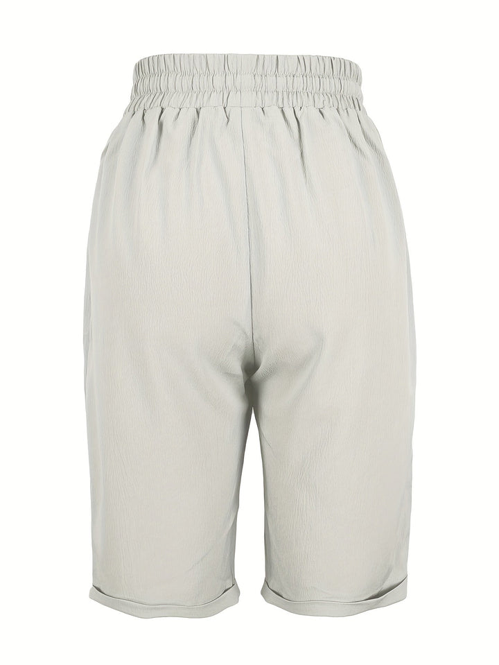 Black women's relaxed fit capri pants, versatile for everyday style & comfortable travel wear.