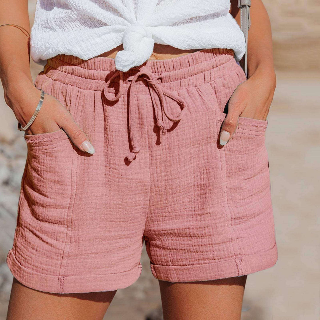 Blue women's relaxed fit summer shorts, perfect for lounging or active wear. Comfortable & breathable.