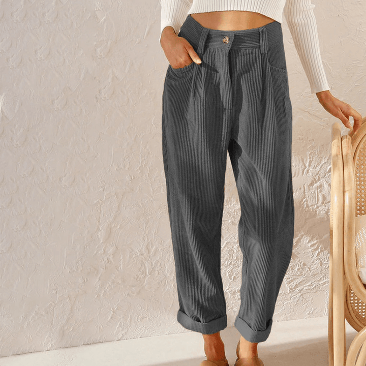 Stylish women's corduroy trousers with a relaxed fit, featuring textured fabric for chic fall & winter fashion.