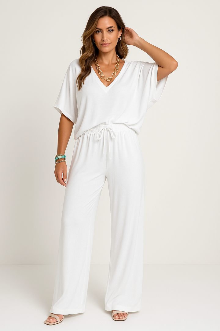 Women's relaxed fit cotton blend lounge set with V-neck top & wide-leg pants. Comfortable two-piece loungewear.
