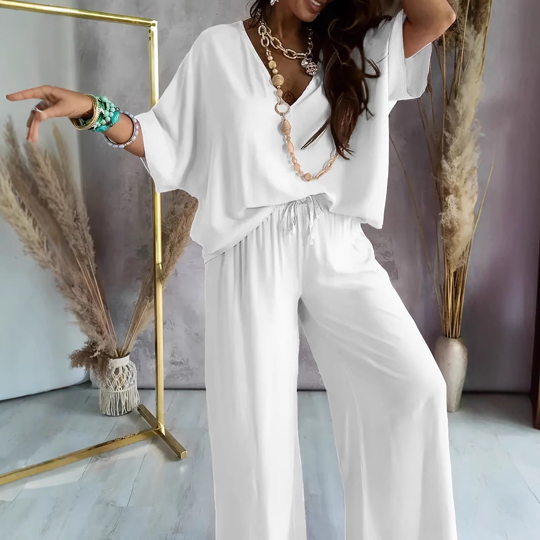Stylish women's cotton blend lounge set, perfect for spring/summer. Relaxed fit V-neck top & wide-leg casual pants.