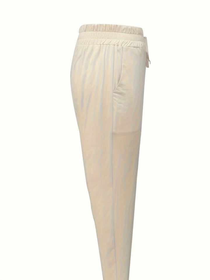 Stylish women's relaxed fit cotton joggers with drawstring & cuffs, ultimate comfort for casual and active use.