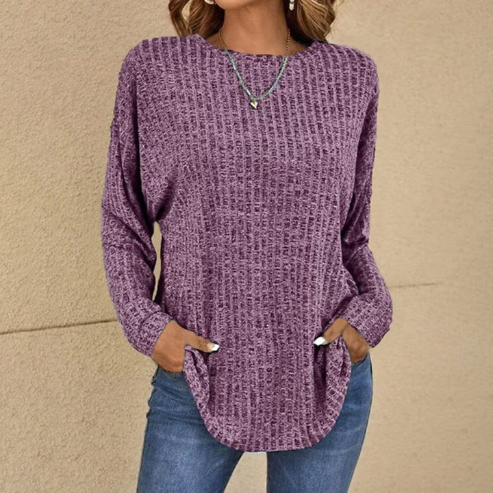 Women's full view of a relaxed fit long sleeve crew neck jumper, perfect for cozy autumn-winter layering.
