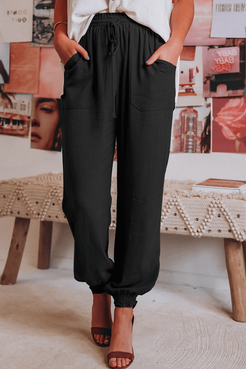 Women's relaxed fit Harlan trousers with adjustable drawstring waist, perfect for casual everyday wear.