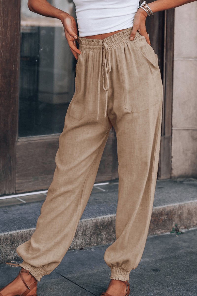 Close-up of the comfortable mid-waist drawstring on women's relaxed fit Harlan pants, ideal for fashion.