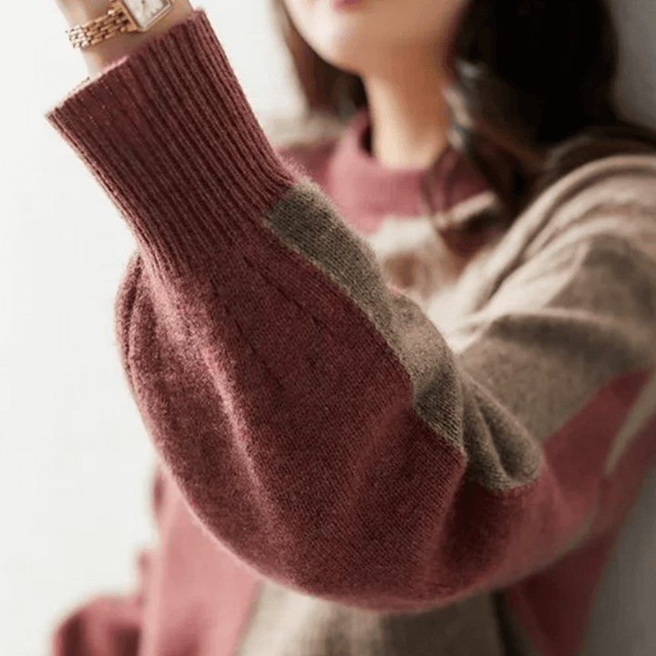 Cozy women's polyester relaxed fit sweater. Hip-length long-sleeve top perfect for everyday comfort.