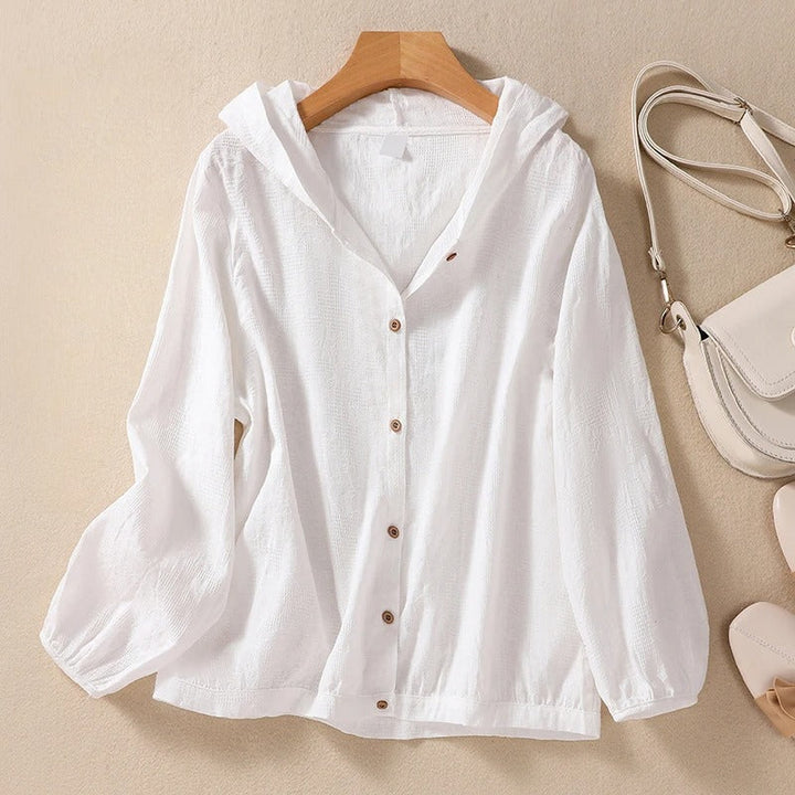 Women's relaxed fit hooded shirt in a comfortable fabric, perfect for everyday casual elegance.