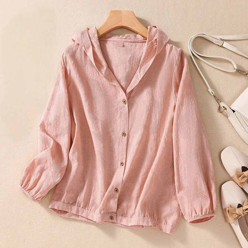 Effortless women's long sleeve hooded shirt with a relaxed fit, ideal for versatile everyday wear.