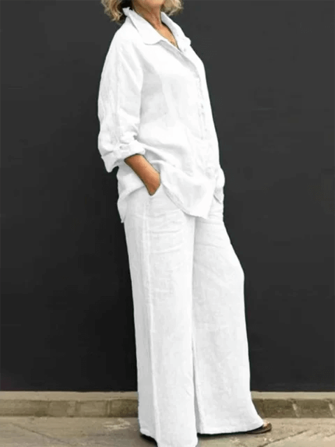 Casual women's two-piece set featuring a relaxed linen blend shirt and wide-leg trousers. Comfortable & chic.