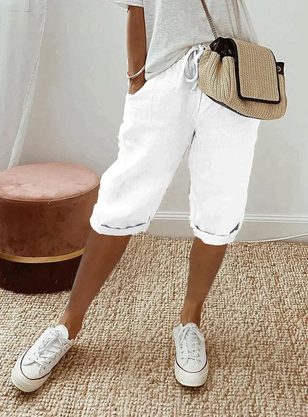 Woman in comfortable linen capri pants, showing relaxed fit and breathable fabric ideal for warm weather.