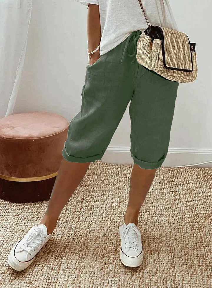 Detailed view of women's comfortable linen capri pants, highlighting soft, breathable fabric & stretch waist.