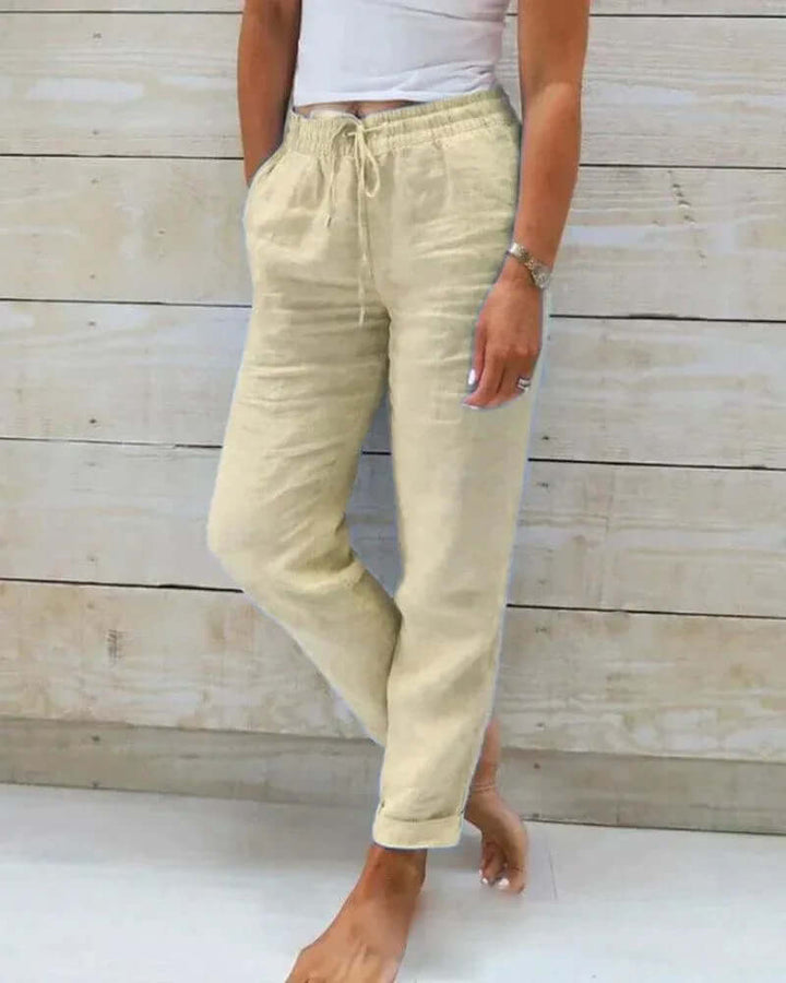 Chic women's linen trousers, relaxed fit with elastic waist & drawstring, offering versatile, lightweight comfort.