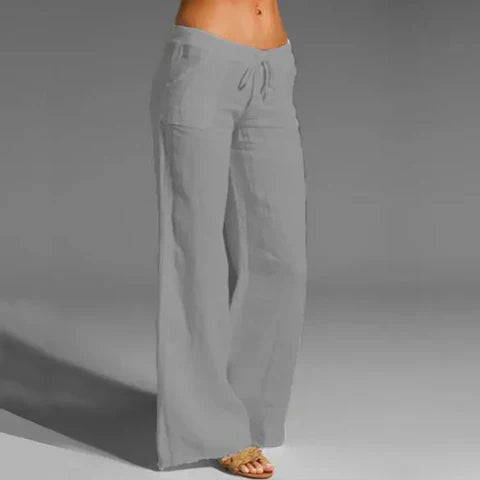 Loose-fit women's linen trousers with elastic waist, great for casual comfort, travel, or summer style.