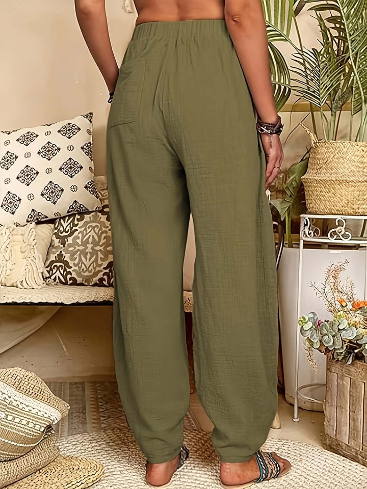 Green relaxed fit linen trousers for women, soft and comfortable for spring & summer fashion.