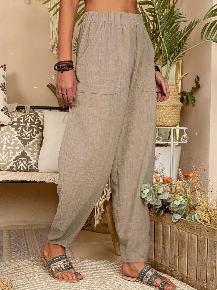 Women's relaxed fit linen pants with pockets, offering breathable comfort for resort and casual wear.