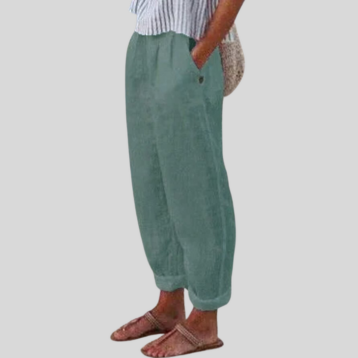 Comfortable women's relaxed fit linen trousers with a chic folded hem, offering a classic and light fabric feel.