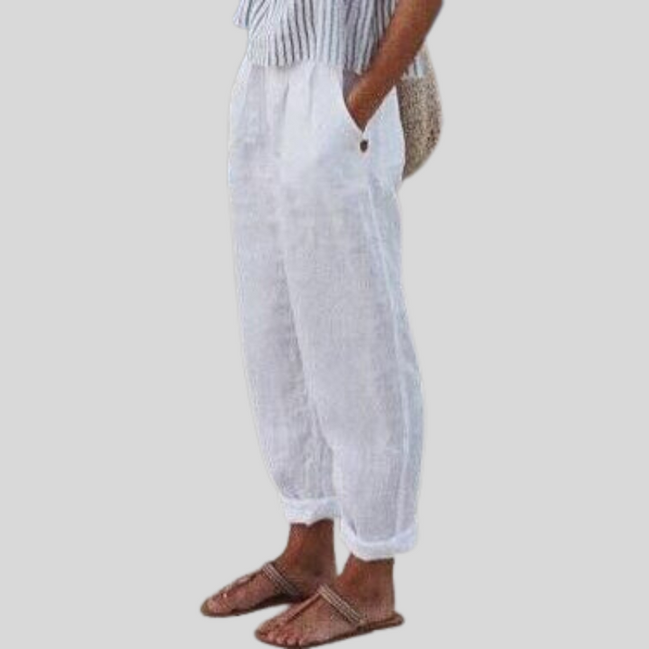 Light fabric women's linen trousers, relaxed fit with a modern folded hem, suitable for stylish, comfortable everyday wear.