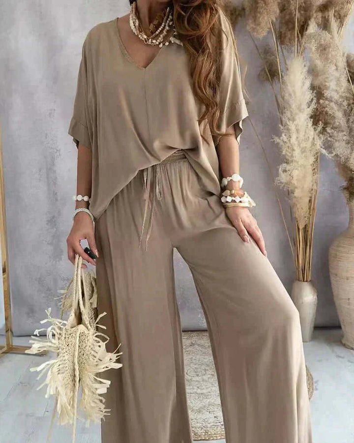 Stylish women's relaxed loungewear set, a comfortable two-piece featuring a V-neck top & wide-leg pants for casual wear.