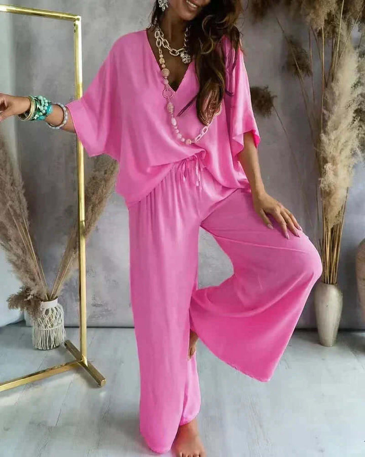Perfect home wear: women's comfortable two-piece loungewear set with a stylish V-neck top & relaxed wide-leg pants.