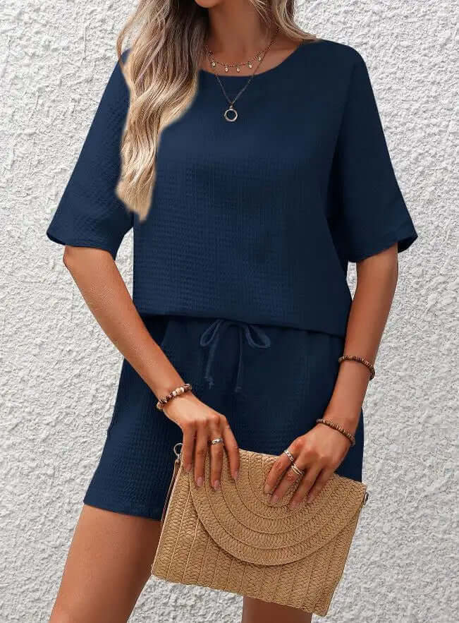 Soft polyester women's two-piece lounge set. Relaxed fit for comfortable casual wear, a perfect everyday outfit.