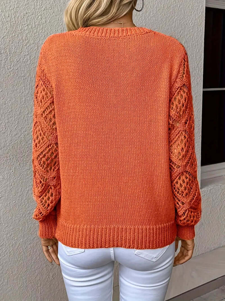 Long sleeve acrylic knit V-neck sweater, a relaxed and elegant layering piece for women.