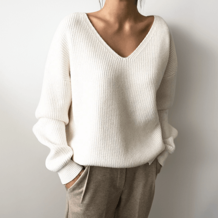 Relaxed fit women's V-neck sweater, soft knit ideal for casual comfort.